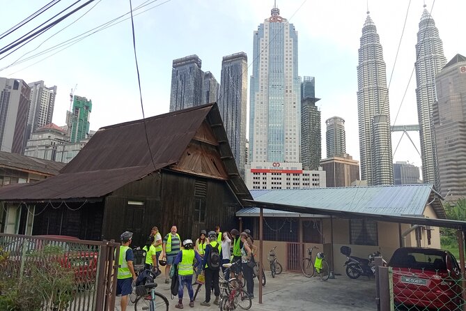 Kuala Lumpur Sunset Evening Cycling Tour - Petaling Street Market: lights, murals, and alley energy