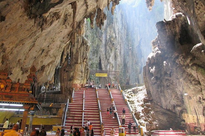 Petronas Twin Tower Tickets & Top Ten Wonder of Kuala Lumpur Tour - Batu Caves: limestone, stairs, and wall carvings